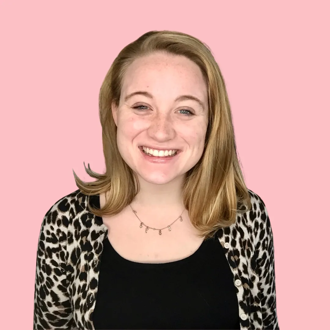 young white woman with blonde hair and smiling at the camera