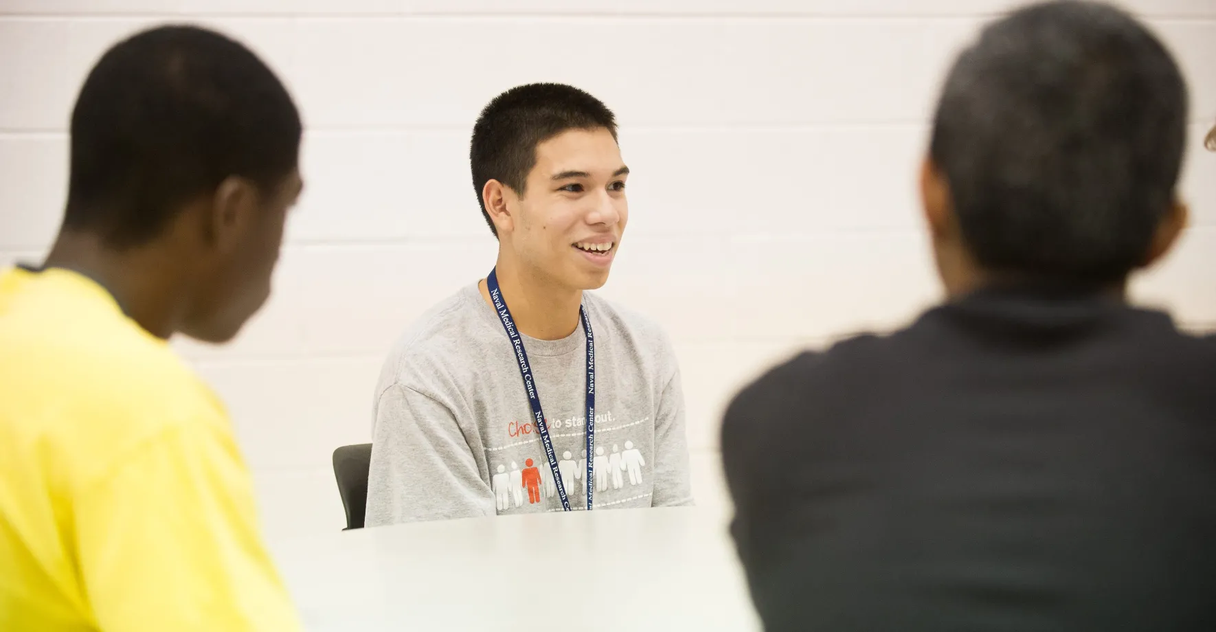 Three students in a classroom