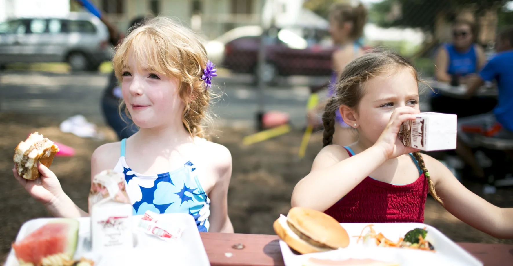 Two girls at a summer meals site