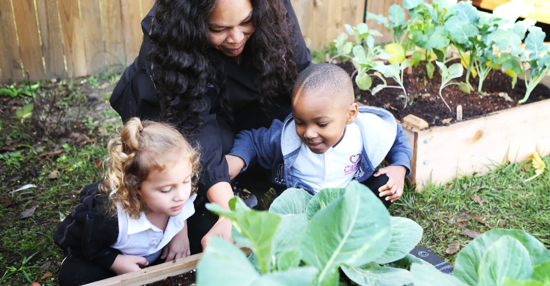 woman with kids in the garden