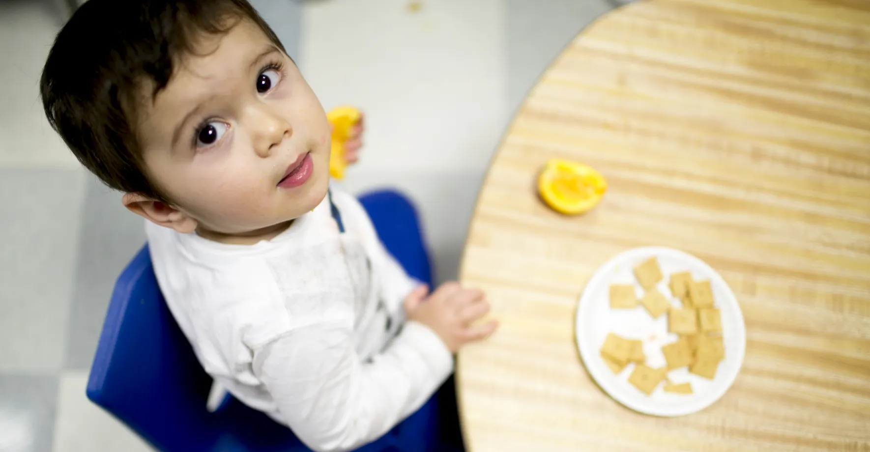 Toddler looking up at camera