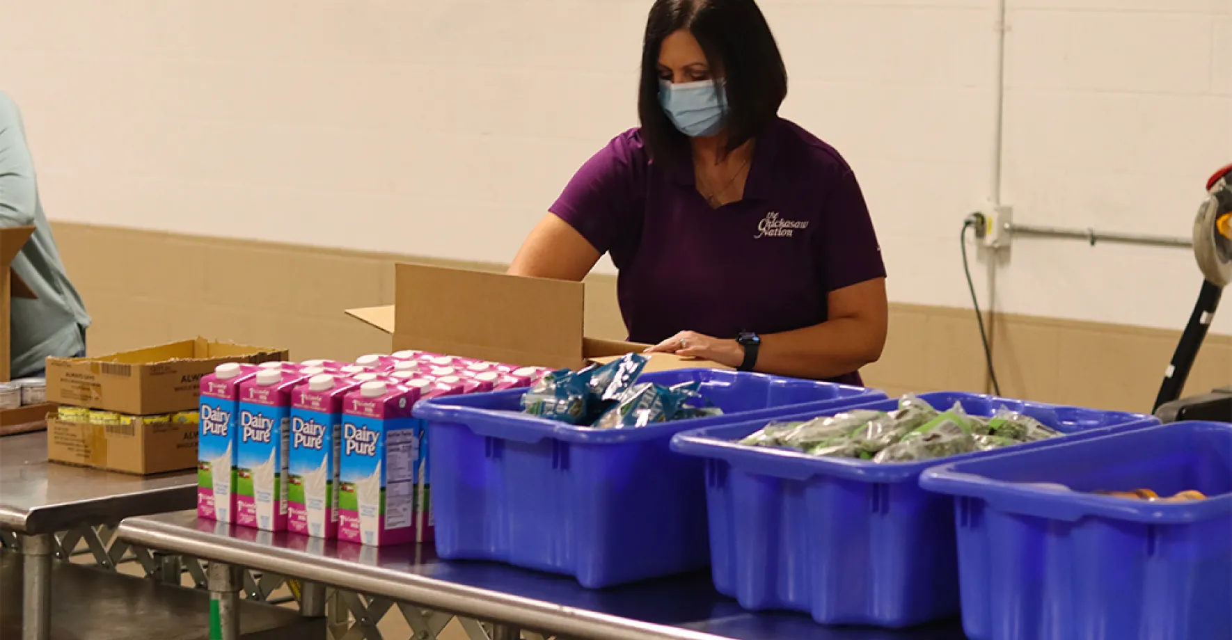 Volunteer preparing meals at food site