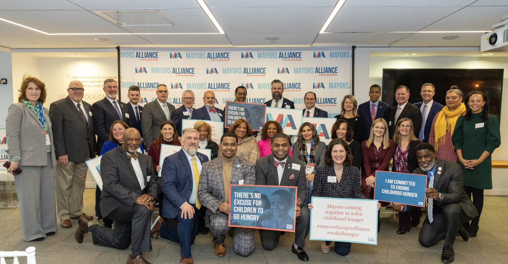 group of Mayors holding signs