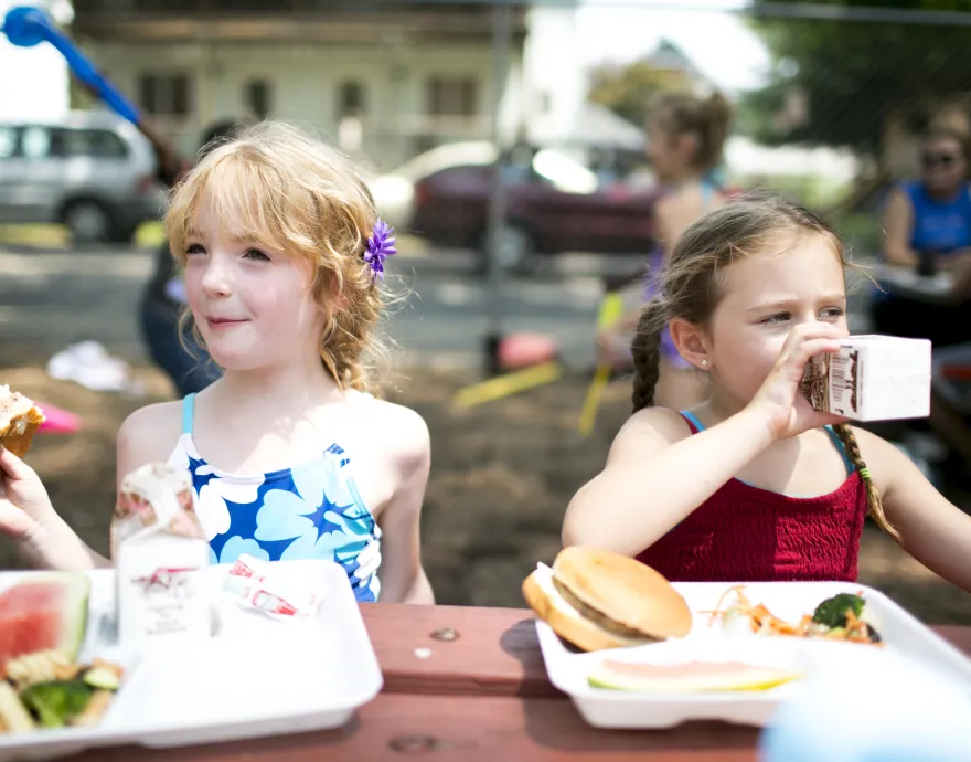 Two girls at a summer meals site