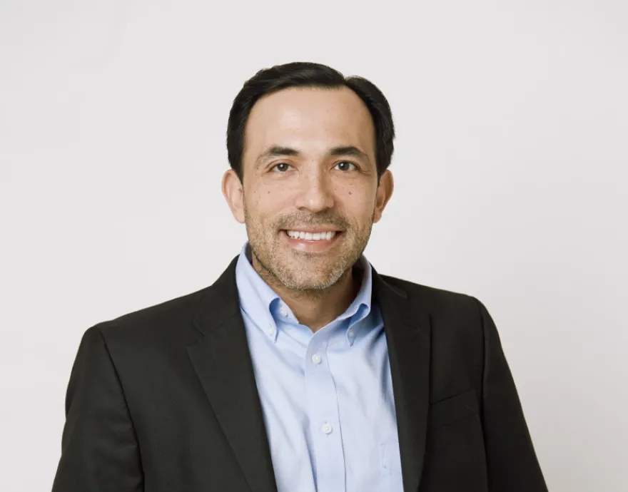 Photo of Latino man in business suit