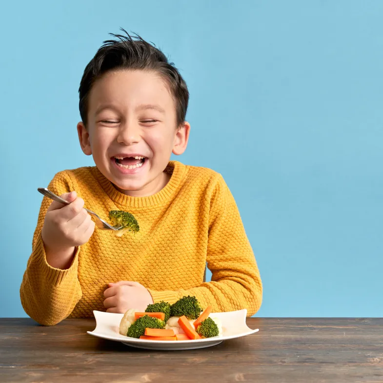 Boy enjoying vegetables