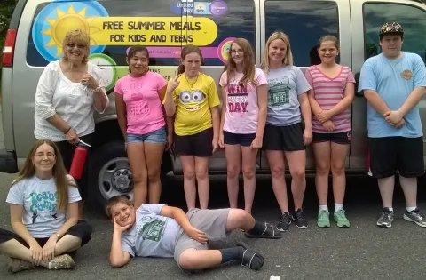 Kids in front of summer meals truck