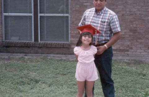 Old photo of girl and dad