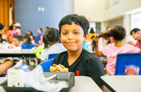 Texas Child Eating Lunch