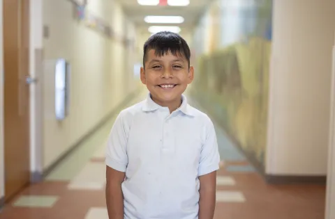 latino kid smiling to camera