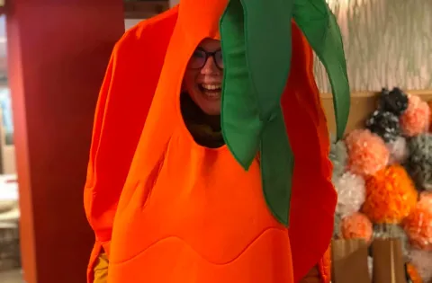 White woman dressed in carrot costume