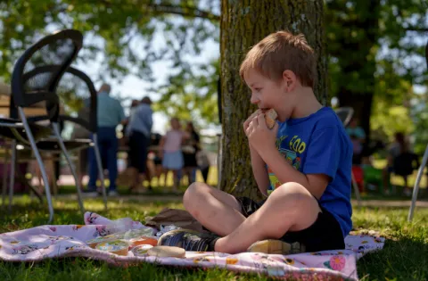 White Kid Eating Outside