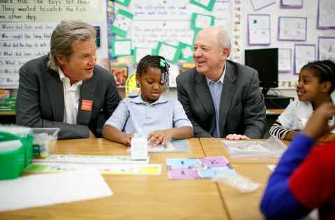 Jeff Bridges and Billy Shore in a classroom with a little girl